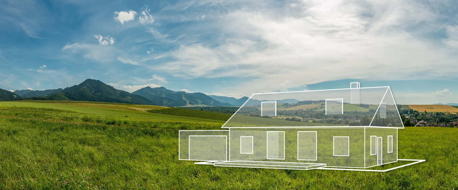 Meadow with mountains in the background, on which a house is drawn in white lines: the house you wish for